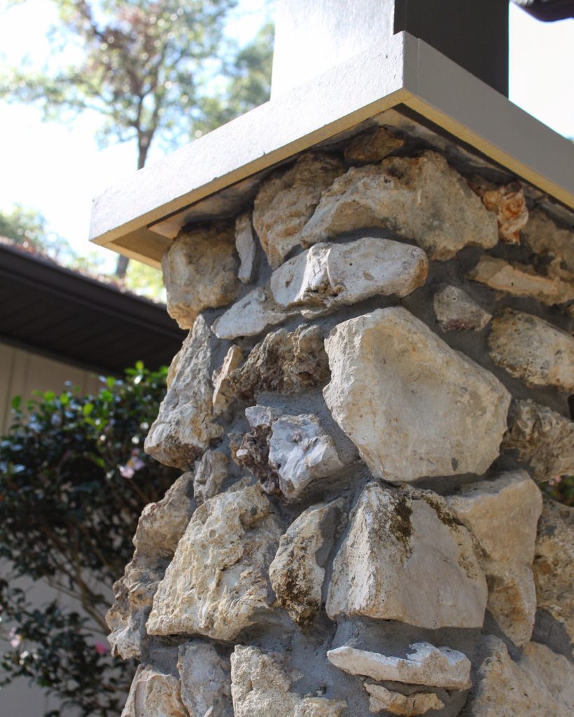Residential entryway with custom stone column detail.