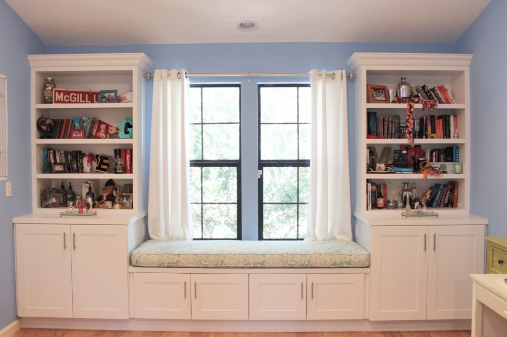 Custom built-in bookshelf and window seating installation.