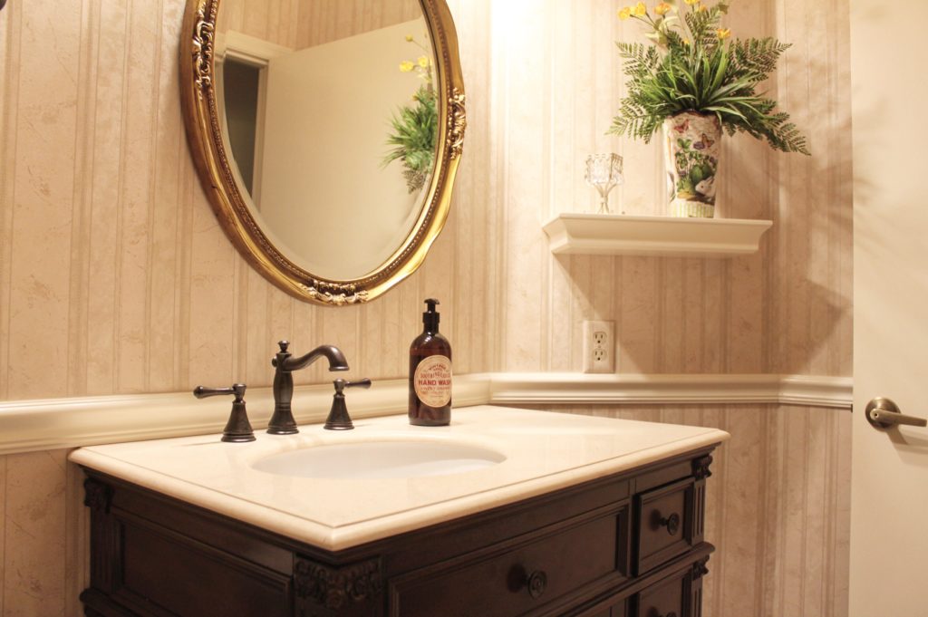 Bathroom vanity detail with upgraded sink and decorative finishes.