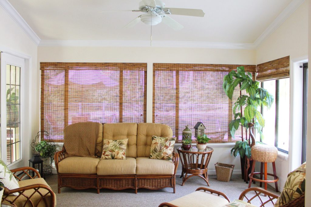 Covered back porch remodel with expanded seating space.