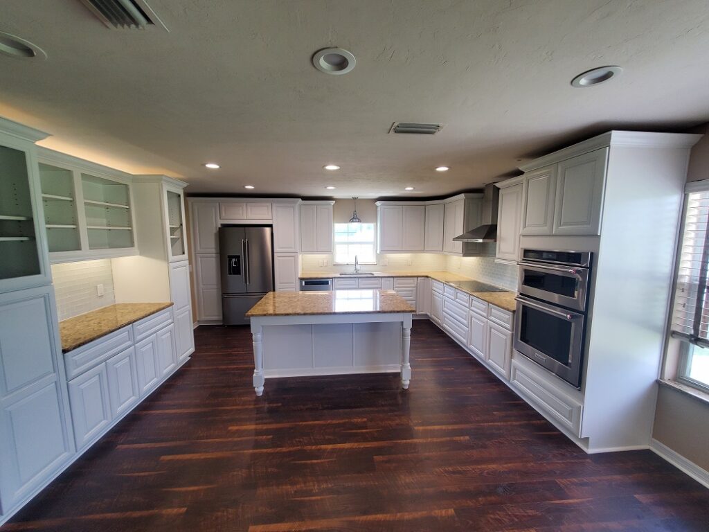 White cabinet kitchen remodel with contemporary finishes.