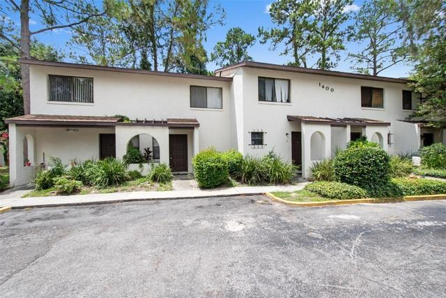 HOA stucco building repair and off-white exterior repaint.